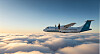 Ett passagerarplan med Brommaflygs färger flyger högt över moln under en klar himmel.